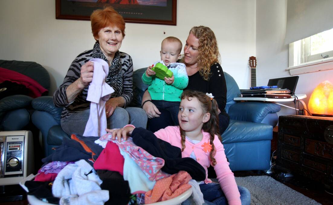 A helping hand: Kylie Aekins (right) with her children Liam and Chloe, and volunteer Gayle Roast. Picture: Jane Dyson
