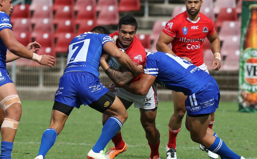 Tough tackling:  Newtown Jets and Illawarra Cutters in action during last year's NSW Cup at WIN  Stadium.  Picture: Robert Peet.
