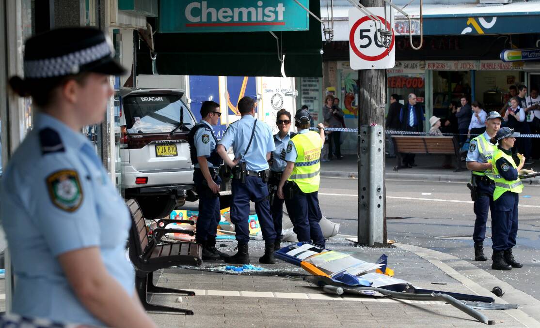 The scene at Kogarah on Monday after the car crashed into the front of the chemist near the bus stop. Picture: Jane Dyson
