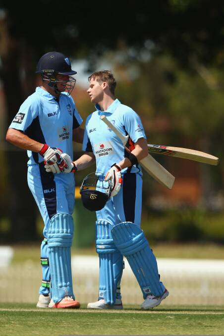 Run machine: St George’s Moises Henriques congratulates Sutherland’s Steve Smith. Picture: Mark Kolbe/Getty Images

