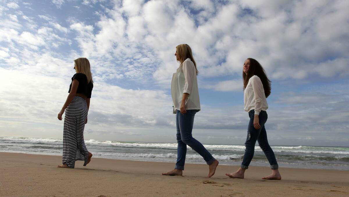 Raising awareness: (from left) Brooke, Hayley and Samantha Turpin at Wanda beach. Picture: John Veage
