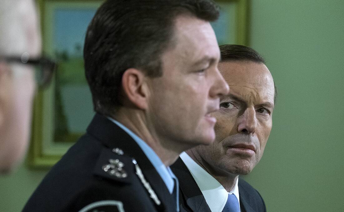 Be Alert: Prime Minister Tony Abbott speaks to the media during a press conference on Friday,  September 12 with AFP Commissioner Andrew Colvin. Picture: Luis Ascui/Fairfax Media via Getty Images.

