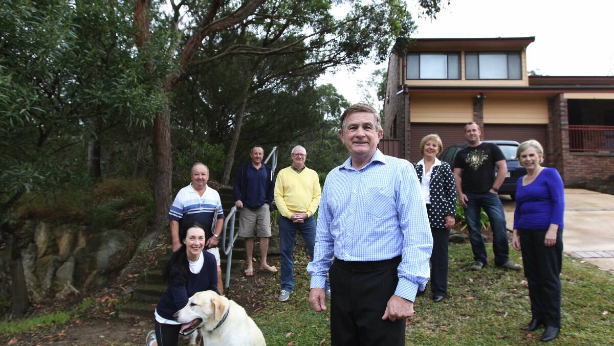 Not standing: Cr Steve Simpson, pictured with neighbours at Alfords Point. Picture: John Veage.
