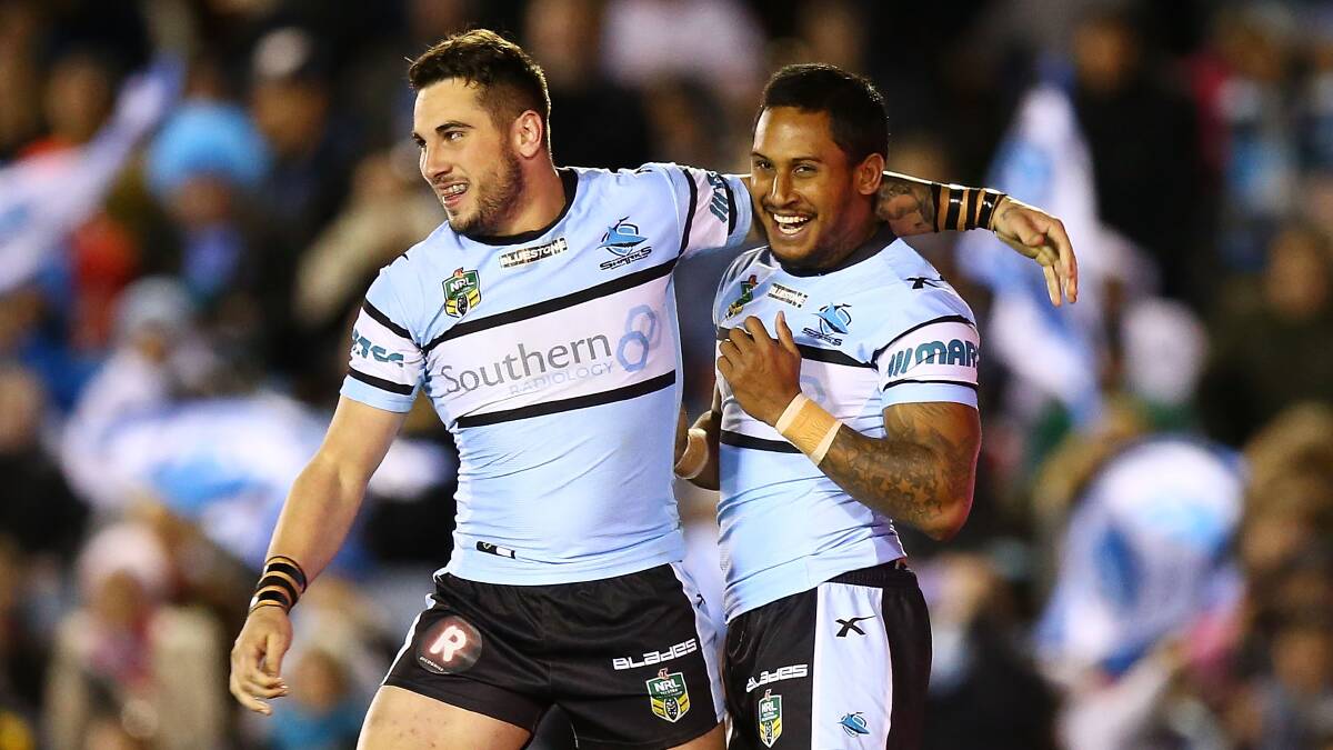 Ben Barba and Jack Bird celebrate a try by Barba during the round 18 NRL match between the Cronulla Sharks and St George Illawarra Dragons on July 12, 2015 . Picture: Mark Nolan/Getty Images.


