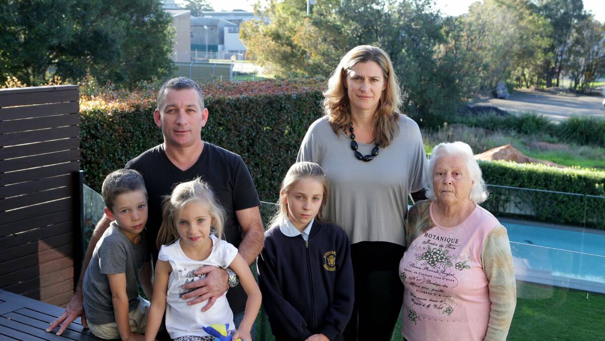 High-rise concerns: Neighbours Jason Matthews, with Riley, 7, and Ava, 5, Lorena Lys, with Grace Maidens, 10, and Kimball Hogan oppose the plans. Picture: Jane Dyson
