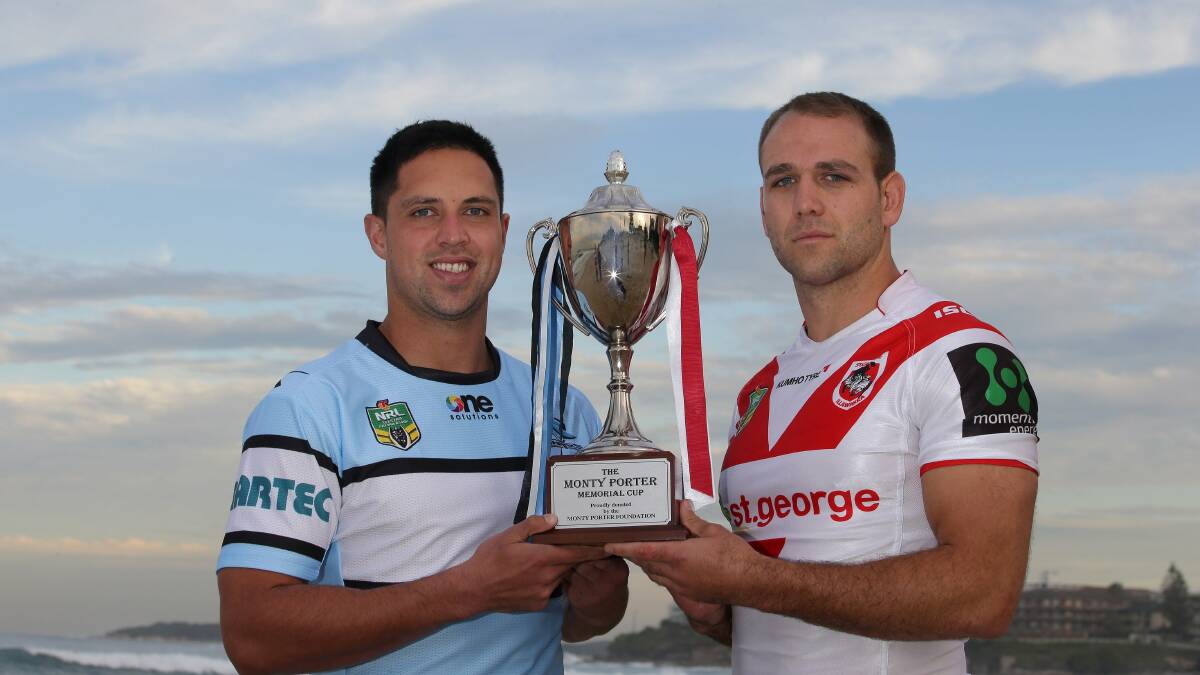 Bragging rights:  Gerard Beale (left) and Jason Nightingale with the Monty Porter Cup in the lead-up to Sunday’s derby at Jubilee Oval, Kogarah. Picture: John Veage
