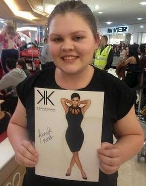 Georgia Mills, 15, scores an autographed picture. Photo: Getty Images.
