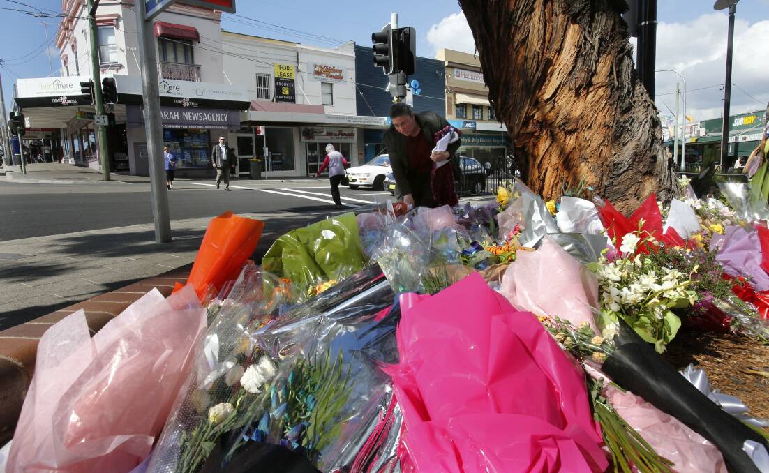 Moving tribute: The floral tributes left for Aneri Patel have now been moved across the road near Kogarah Railway Station. Picture: John Veage
