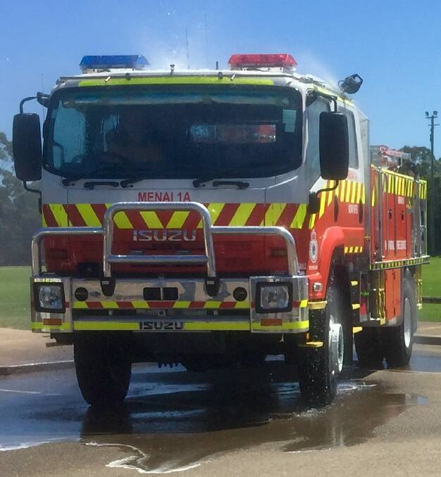 
Resources boost...New Catgeory 1 fire truck, with protective spray
operating, at Menai station. Picture: supplied
