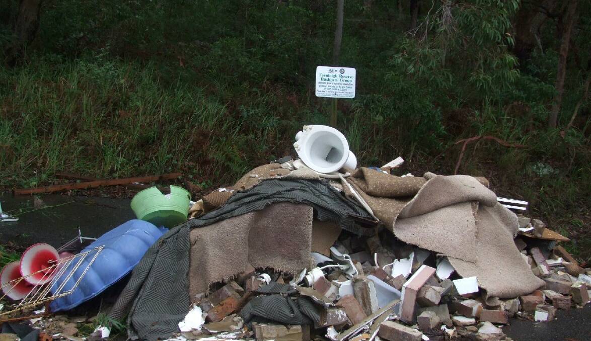 Shame of thrones: The pile of building material including a toilet left in Fernleigh Road, Caringbah, outside the road to the Scouts hall. Picture: Supplied
*See story below.
