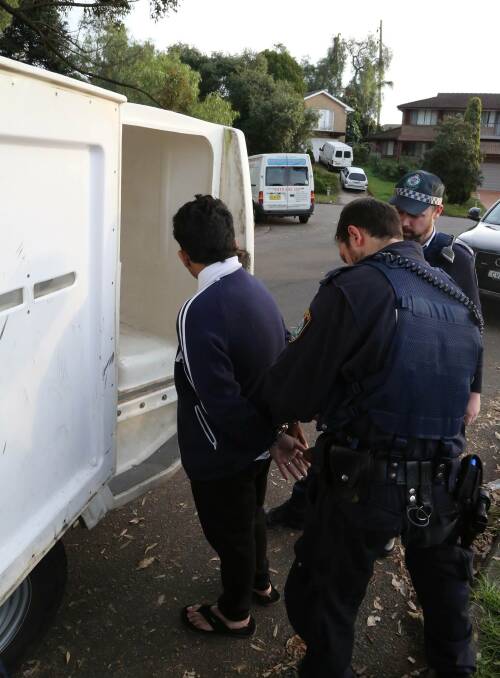 Caught: Police arrest four men over a $1 million fraud. Picture: NSW Police Media.
