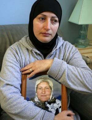 Killed: Salwa Haydar holding a picture of her mother in 2007. Photo: Janie Barrett
