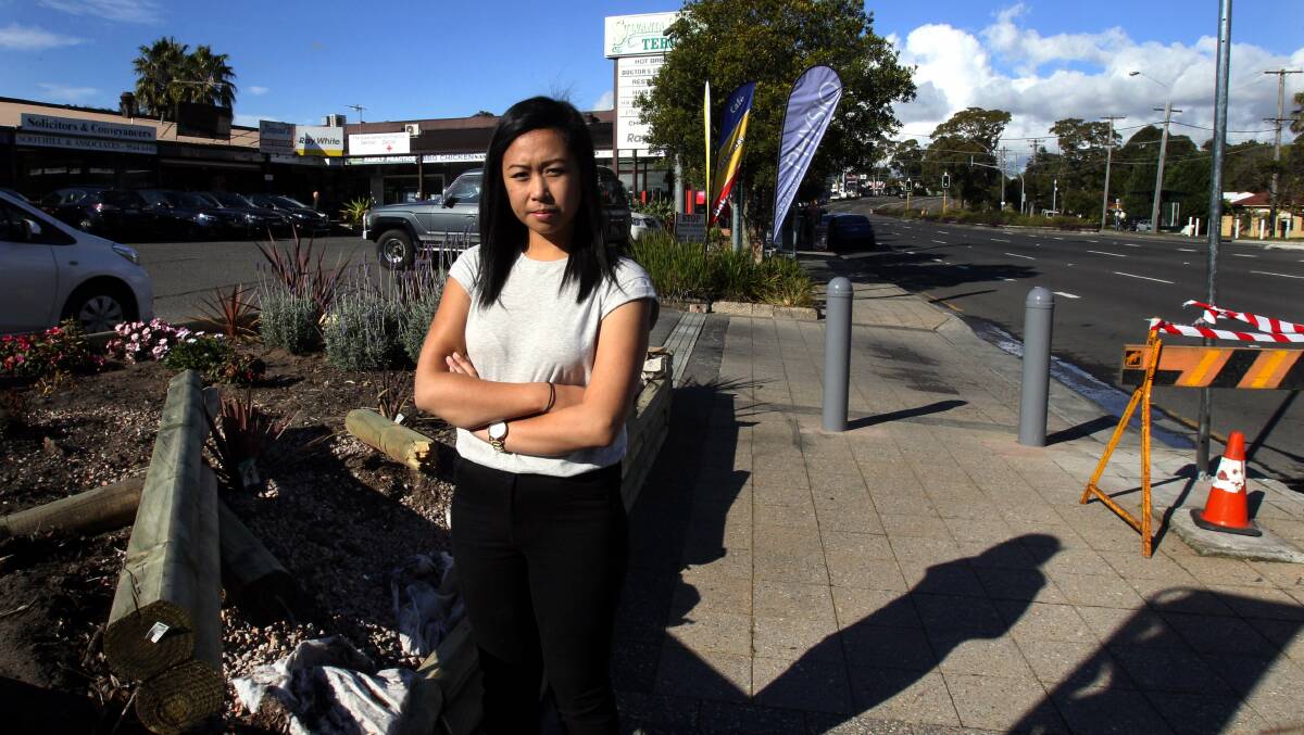 Narrow miss: Judy Huynh at the spot where her father, shopkeeper Hong Huynh, was nearly hit by a car. Picture: Jarod O’Shannessy
