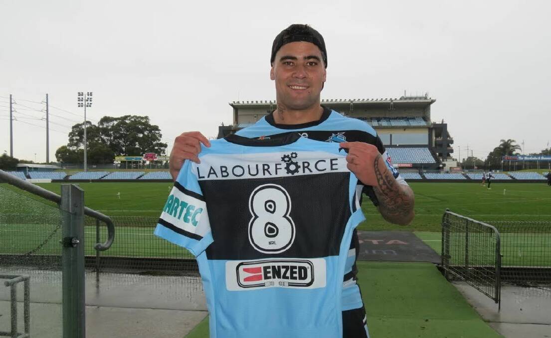 Ready to go:  Cronulla prop Andrew Fifita shows off the jersey with the new sponsor’s name.

