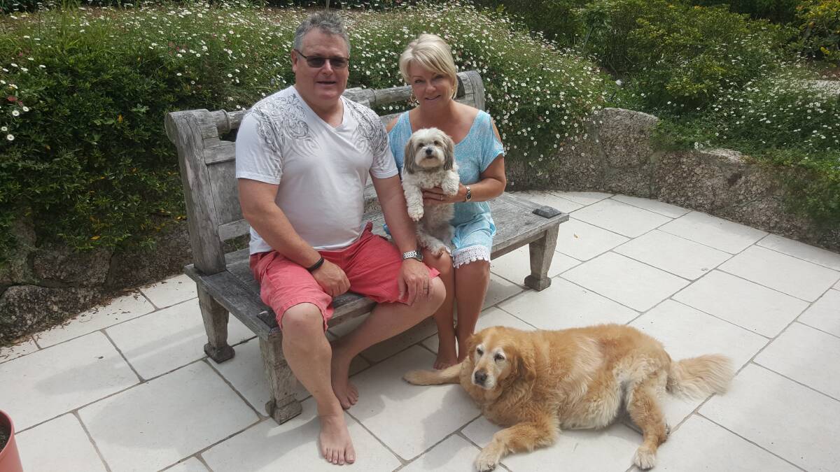 Happy family: Jon and Pam Heneghan and Jess and Mia (the dogs). Picture: Supplied
