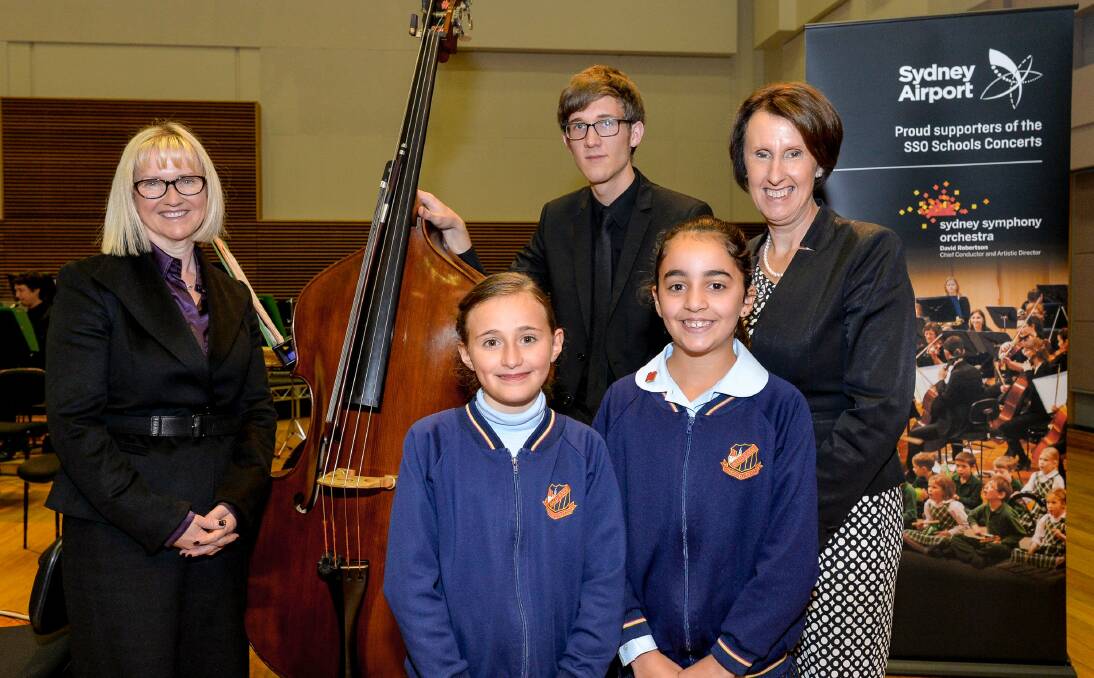 Musical collaboration: Pupils Antonia Krithinakis and Alannah Christodoulou pictured with state minister for early education and assistant minister for education Leslie Williams, Sydney Symphony Orchestra musician John Keene, and Sydney Airport managing director Kerrie Mather.
