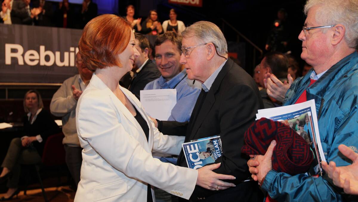 Labor legend: Neville Wran, with Brian Dale (right) at his side, is greeted by prime minister Julia Gillard at the 2011 NSW Labor Party conference.
