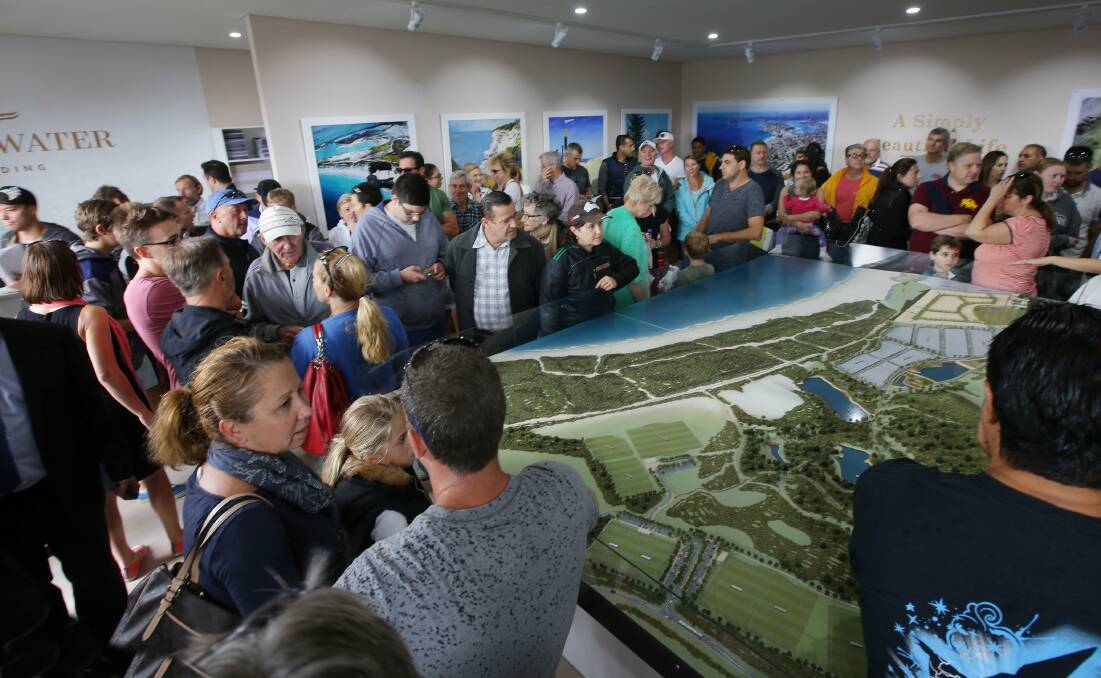 Coastal dream: There was standing room only at the auction on Sunday. Picture: John Veage

