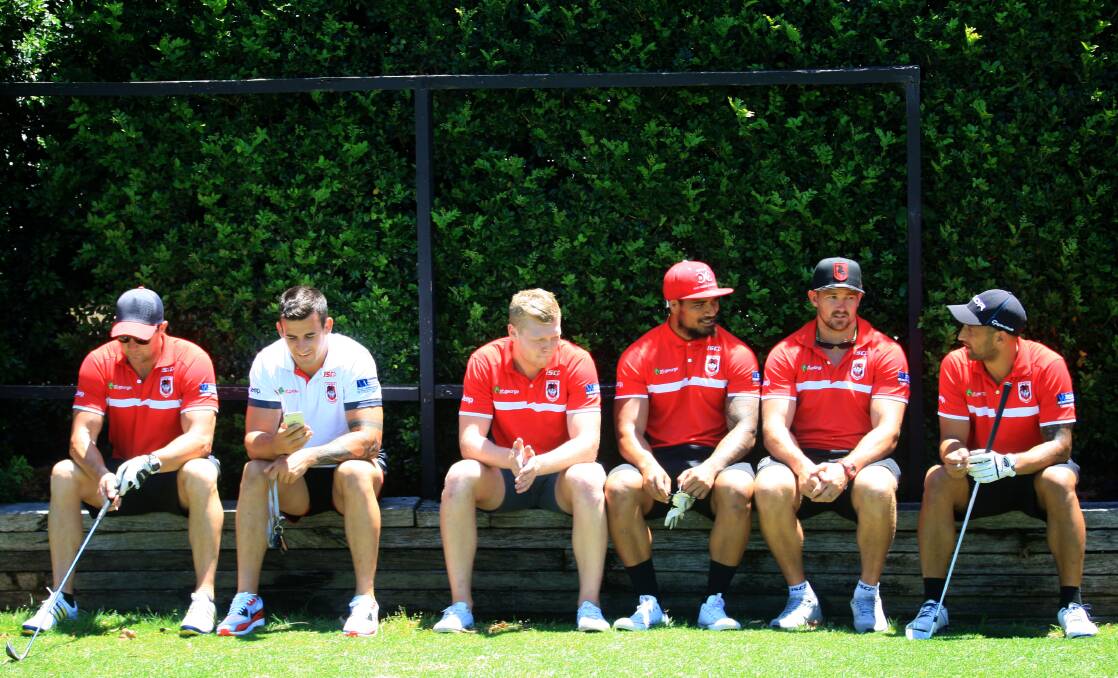 Rest while you can:  Dragons players including Benji Marshall (far right) take a break from the heat during a team golf day in Kogarah last year. Picture: James Alcock.
