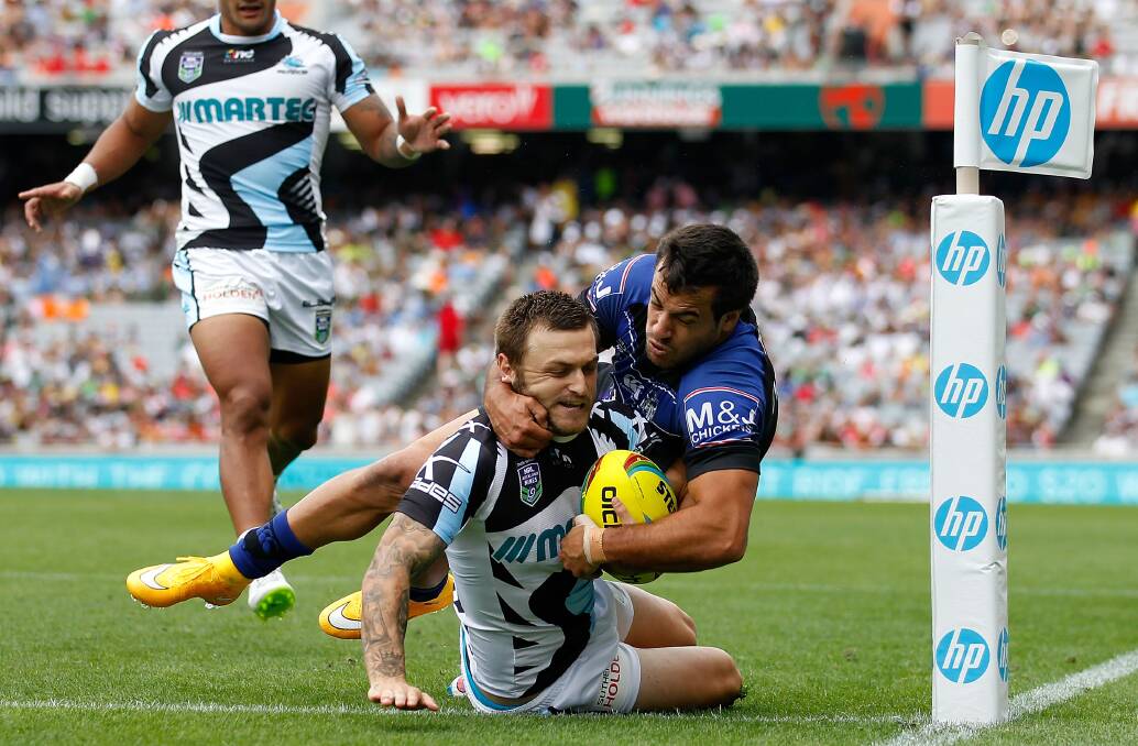 Try time: Nathan Gardner scores a try for Cronulla against the Bulldogs at last year’s Auckland Nines. Picture: Simon Watts/Getty Images.

