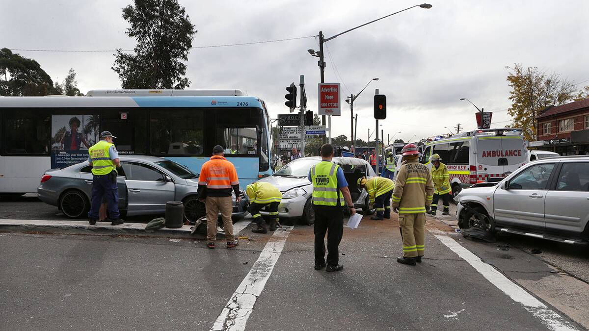 Crash: The scene at Banksia on Monday morning after four people were injured when three cars and a bus collided. Picture: Jane Dyson
