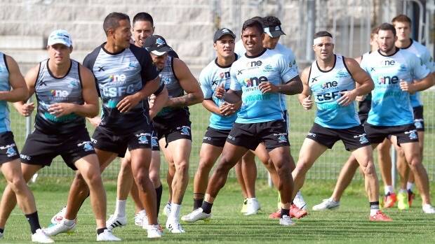 Stretching out: Sharks players warm up during a training session at Remondis Stadium on Monday. Photo: Renee McKay
