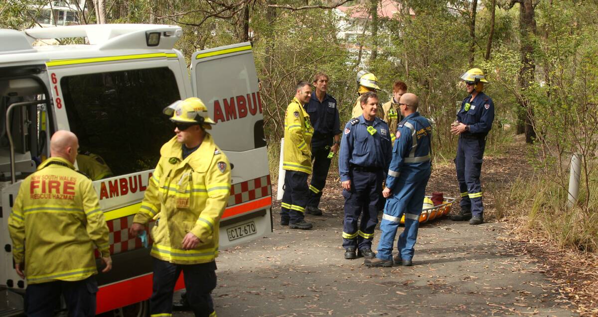 Bush rescue: Emergency services crews at the scene. Picture: Chris Lane.


