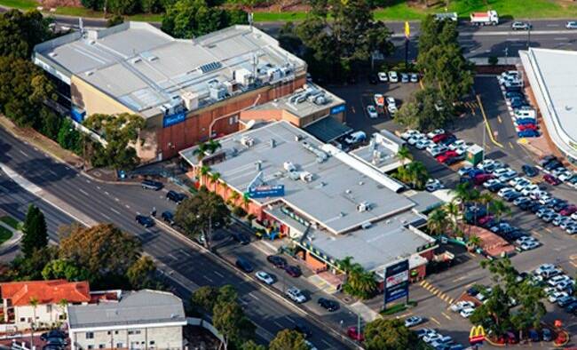 Aerial view: The Crest Hotel (foreground) with the fitness centre (top left) and shopping centre to the right.
