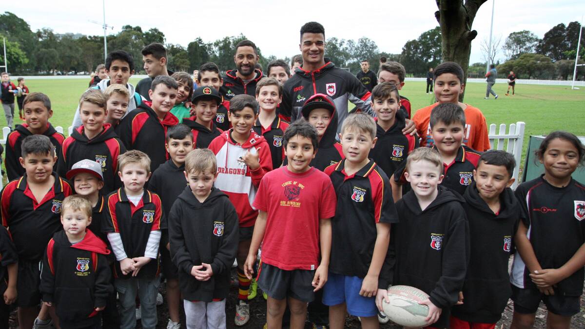 Debut: Benji Marshall (back left) and Yaw Kiti Glyman (back right) meet the youngsters from  Arncliffe Scots Junior Rugby League club at Cahill Park.Picture: Sam Venn
