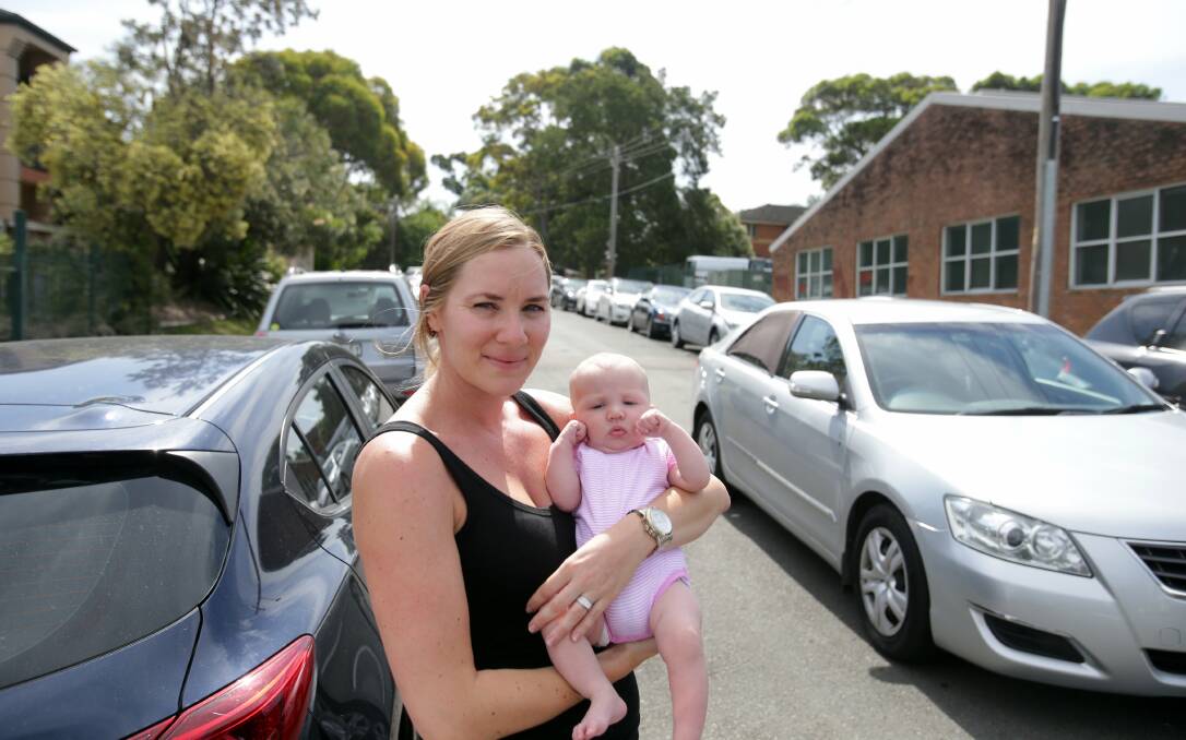 Bumper to bumper: Kristie Phillips and baby Zara in Kumbardang Avenue.Picture: Chris Lane.
