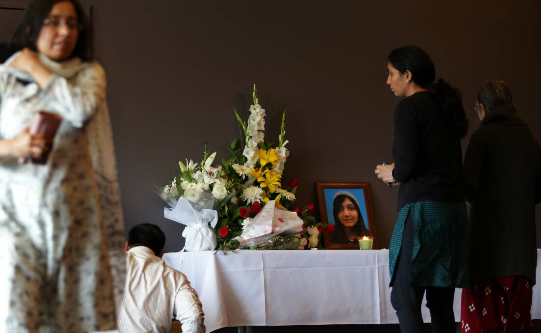 Paying respects: Family and friends at Aneri Patel's memorial on Sunday. Picture: John Veage.

