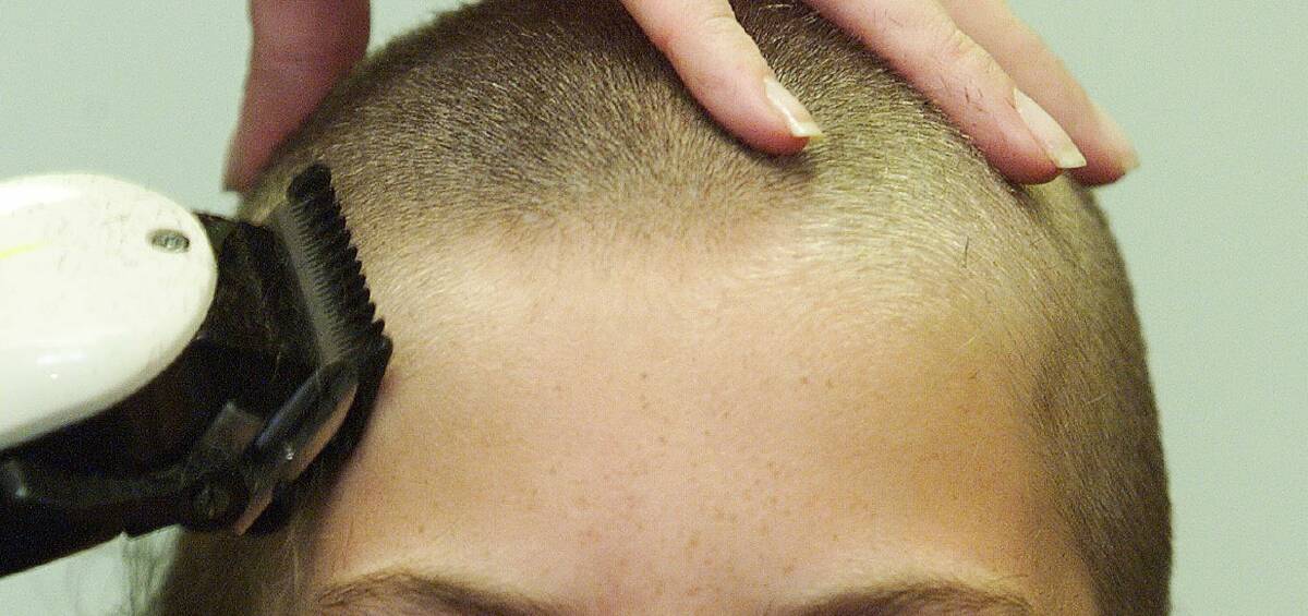 A shave too close: Two students have been suspended for shaving their heads to support a classmate. 