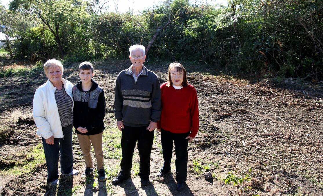 Council acts: Wendy Gettens, her grandson Jye and neighbours Bill and Pam Heather in a cleared area behind their homes. Picture: Jane Dyson
