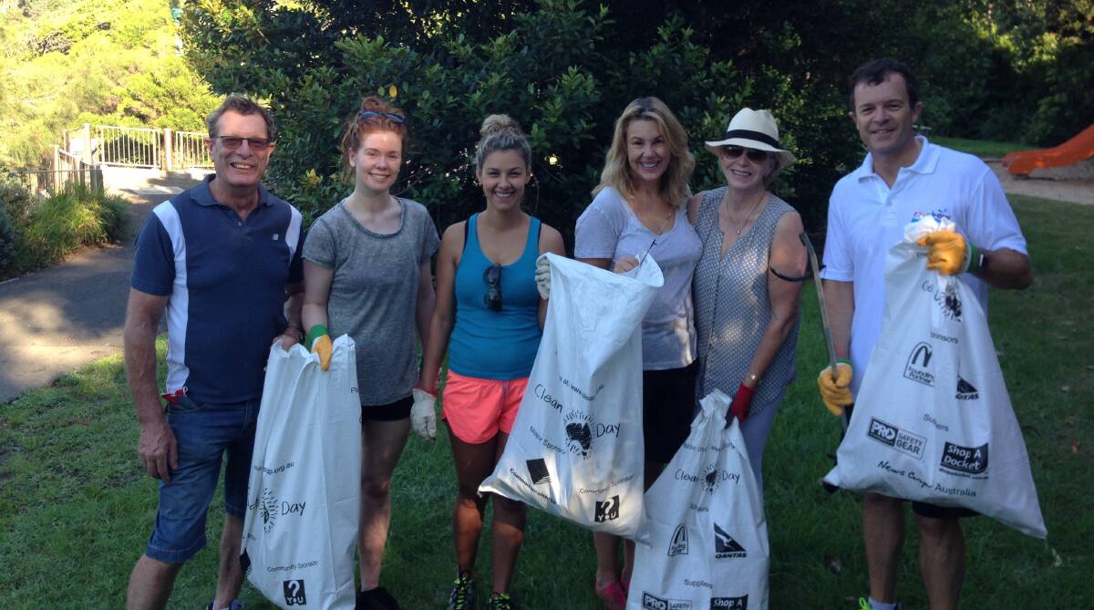 Keeping it clean: Ross Howie, Emma Salmon, Georgia Brown, Caroline Speakman, Cr Carol Provan and Cronulla MP Mark Speakman at Bass and Flinders Point Sunday morning. Picture: supplied.