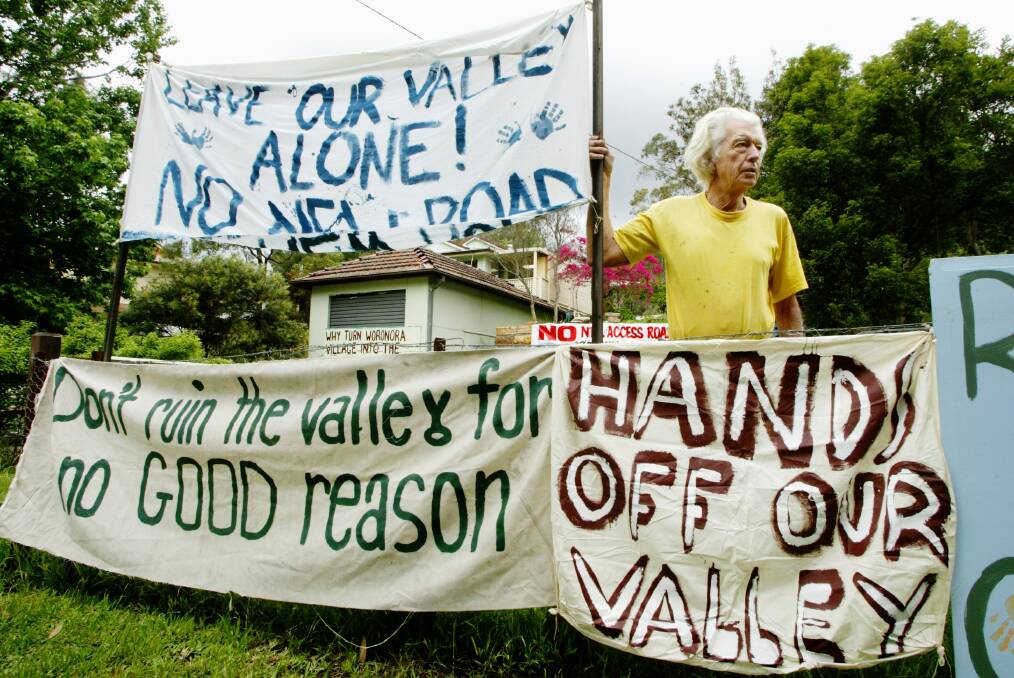 Hot topic: Residents, including Norm Dixon (pictured) protested against the opening of the fire trail in November 2004. Picture: Anthony Johnson.
