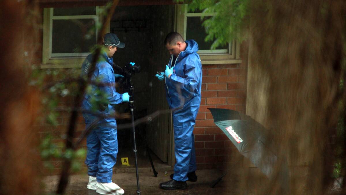 Police at the suspected murder scene in Mangerton. Picture: SYLVIA LIBER