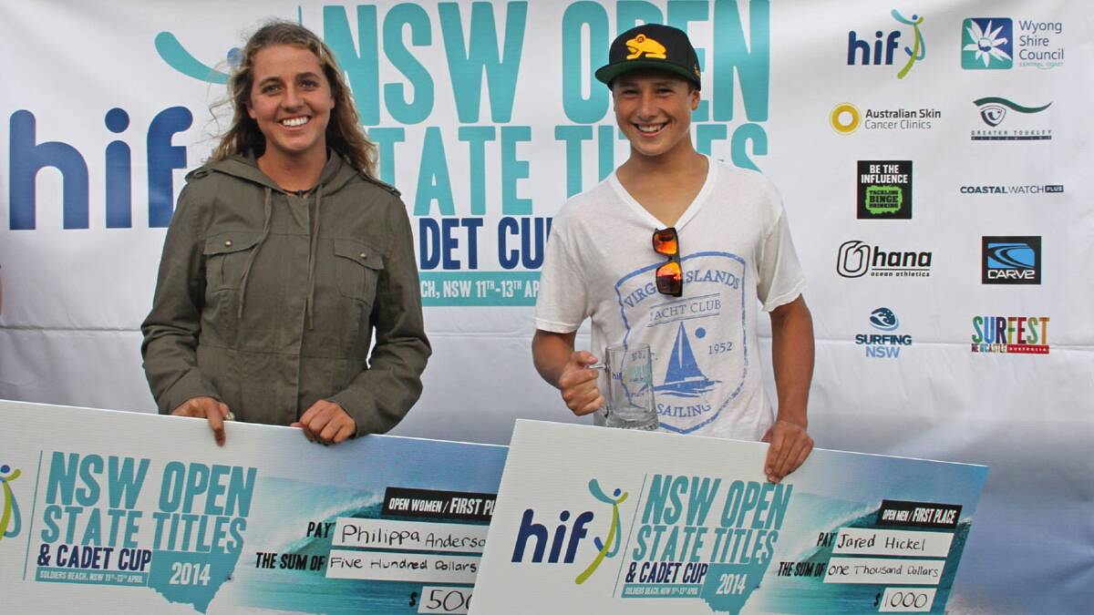 Philippa Anderson (Merewether) and Jared Hickle accept their winners cheques. Picture SNSW/Smith