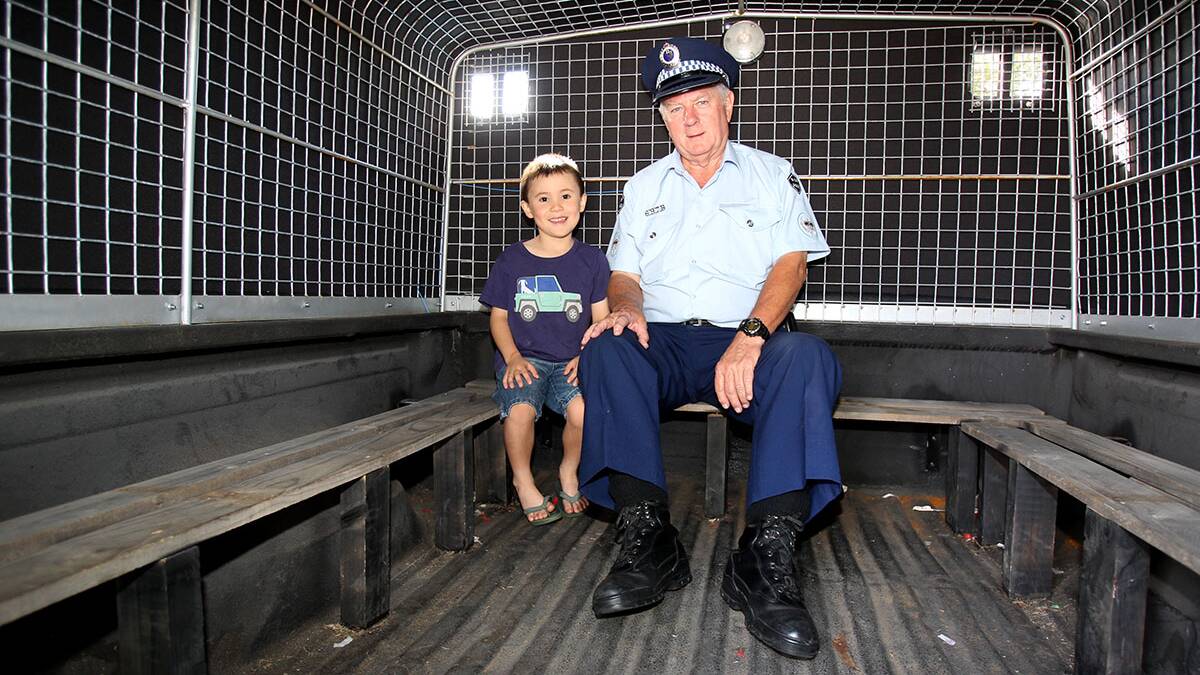 Volunteer Des Reading with Joshua 6 from Carlton sitting in the 1977 F100 paddy wagon.Picture : Lisa McMahon.
