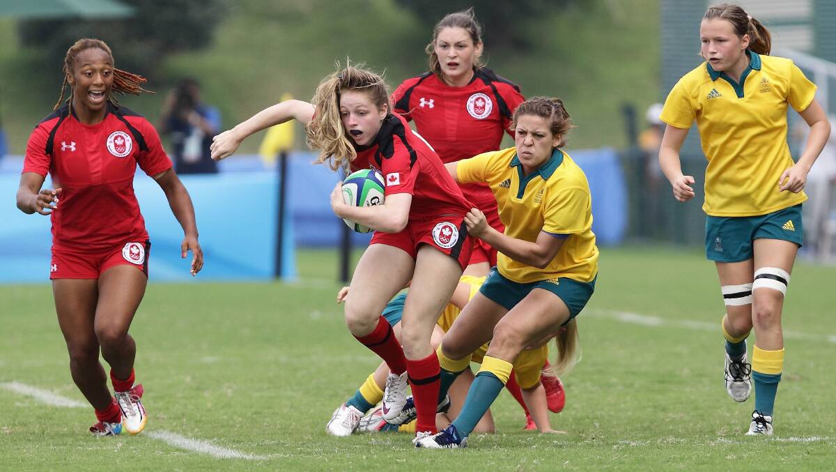 Gold medallist: Brooke Anderson makes a tackle playing for Australia against Canada at the World Youth Olympic Games in Nanjing, China. Australia defeated Canada, 38-10. Picture Getty/Suhaimi Abdullah