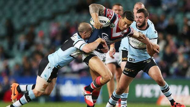 Sonny Bill Williams tries to make a break for the Roosters against the Sharks. Photo: Getty Images