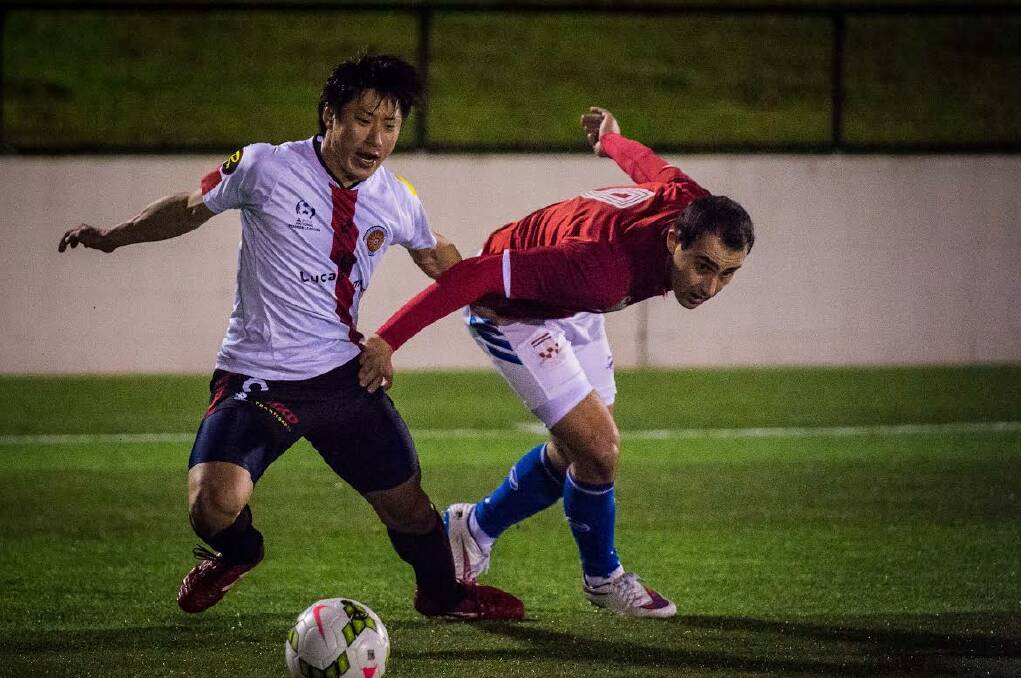 Eliminated: Rockdale City's Takuya Murayama (left) battles for the ball in last night's 3-2 Waratah Cup semi-final loss to Sydney United 58. Picture: Football NSW.