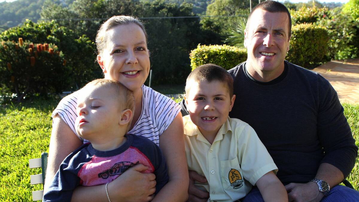 Family's fear: Sue Cash and husband Steve whose two children, Charlie, 2, and Dylan, 6, have disabilities, hopes funding for the NDIS won't be cut in the federal budget. Picture: John Veage
