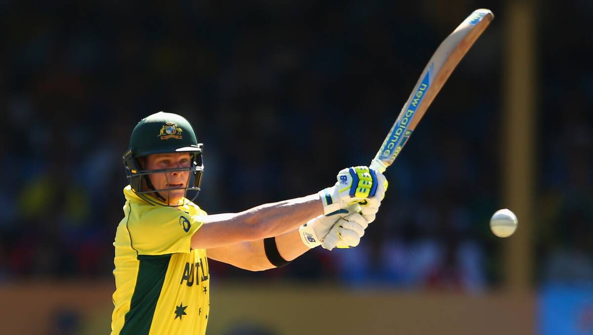 Centurion: Sutherland and Australian batsman Steve Smith on his way to a mighty hundred in the ICC World Cup semi final, yesterday, at the SCG. Picture: Cameron Spencer/Getty Images.