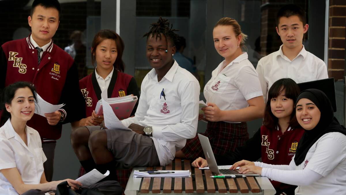 Done and dusted: Kogarah High School students enjoy a much-needed breather after their English as a Second Language HSC exam yesterday.