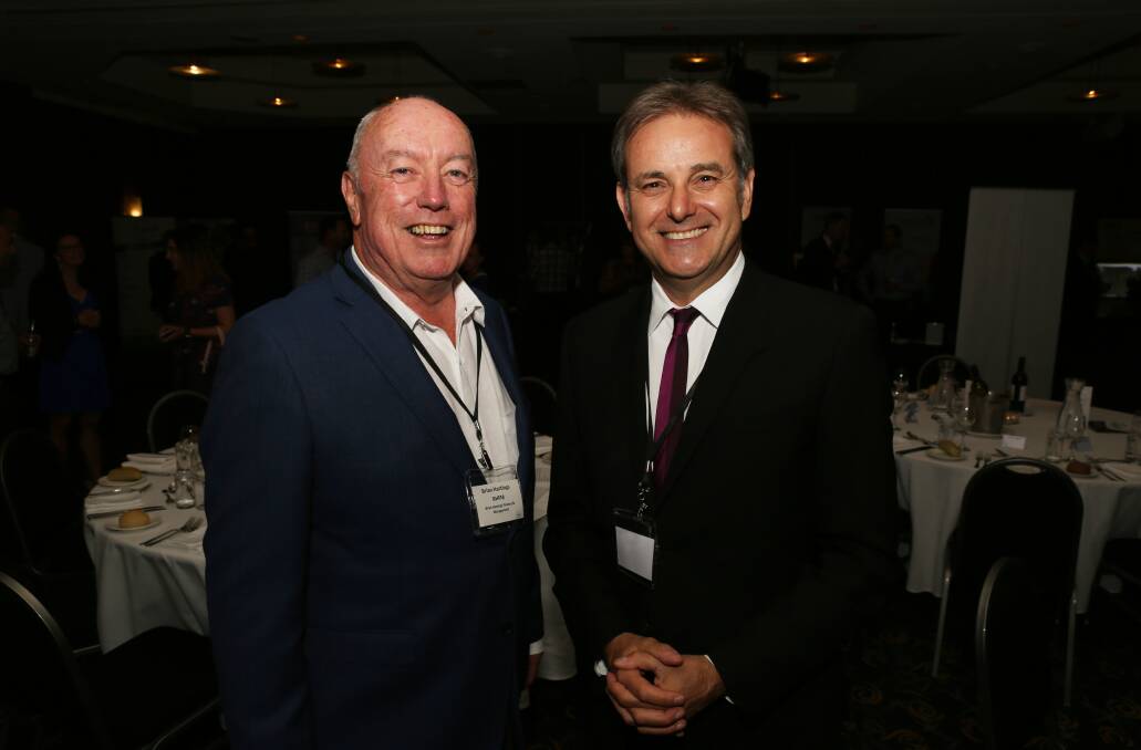 Cycling big business: Brian Hastings brought his round ball football friend Mike Tomalaris to Wollongong for the i3net Illawarra Industry Showcase in November. Picture: Greg Ellis.
