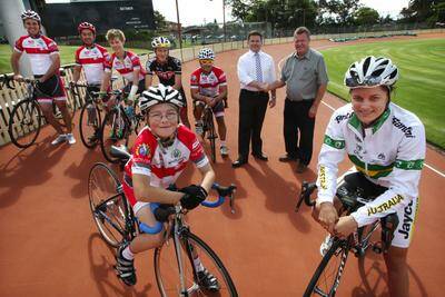 Cash injection: The state government has contributed more than $80,000 to upgrade Hurstville Oval’s velodrome. Pictured are: Oatley MP Mark Coure with St George Cycling Club president Phil Bates, Australian cyclist Ashlee Ankudinoff (far right) and other members of the cycling club. Picture: John Veage
