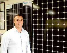 Make the most of the sun: Matt Purvis from SolarSwitch with solar panels. Picture: Chris Lane