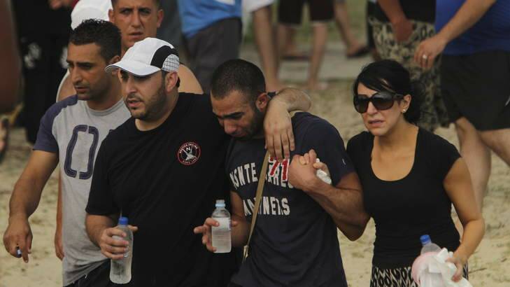 Scenes of distressed people at Sandringham Beach in Sydney where a child is feared drowned. Photo: Sahlan Hayes