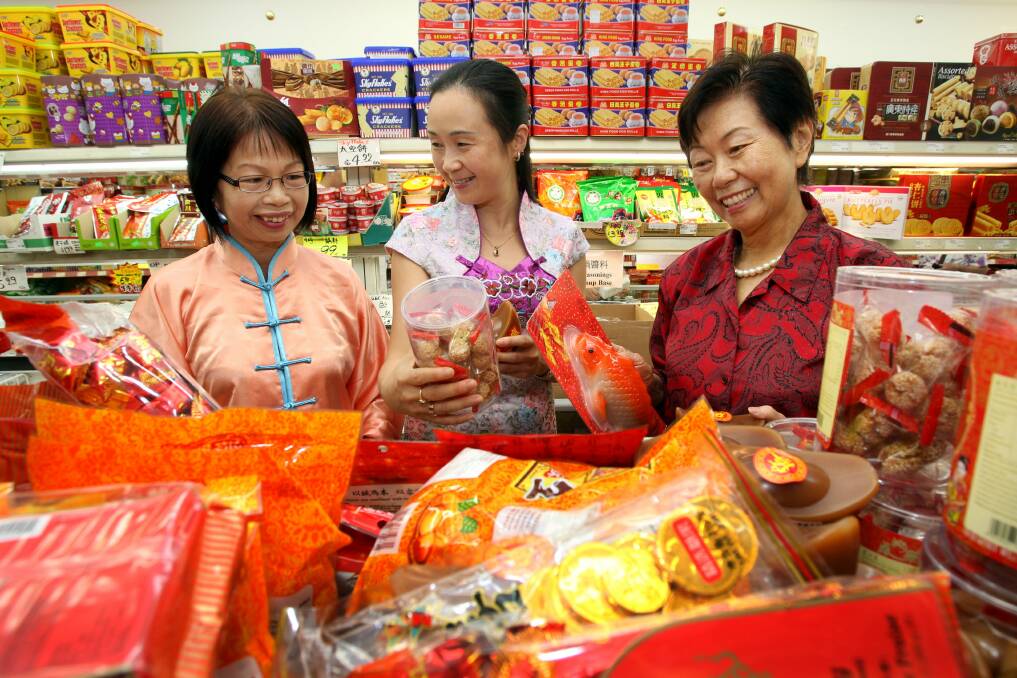 New Year Preparations: Maggie Lei, Nacny Lui and Maryann Zhao shopping in Hurstville ahead of the Chinese New Year celebrations. Picture: Jane Dyson