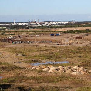 The future?: This former sand mining site could become a housing estate and below the Greenhills Beach estate takes shape. Pictures: John Veage